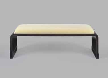 Jean Dunand black lacquer bench. Jean Dunand style bench, crackle black lacquer, waterfall plywood frame, cream upholstered seat, front view, Vosges France.