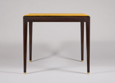 Dupre Lafon Games Table Mahogany, darkened mahogany, unlacquered brass trim and sabots, leather top, front view.