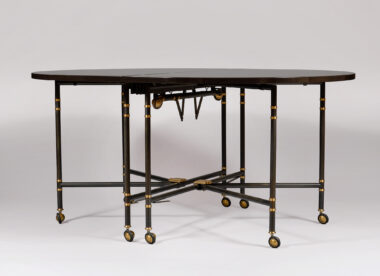 Maison Jansen Folding Table. Ebonised gate-leg dining table partially open, reeded black lacquer legs with brass castors and X-stretcher, French mid-century style, handmade to order by Vosges Inc